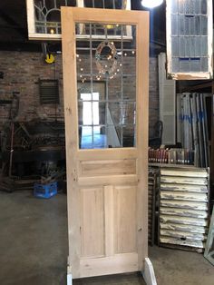 a wooden door sitting in the middle of a room