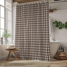 a brown and white checkered shower curtain next to a bathtub in a bathroom