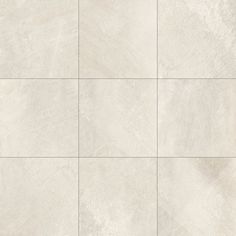 a white tile wall with squares in it