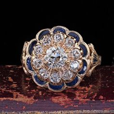 an antique diamond and blue enamel ring