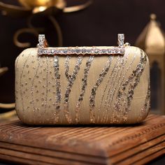 👛 Our Gold wedding clutch for bride is an elegant addition to your big day . This stunning gold sequin and thread embroidered clutch is ideal for any special occasion. The clutch bag is embellished with intricate embroidery. The clutch bag is closed with a designer snap. It is the ideal size for carrying your essentials like your phone, wallet, and keys. ✅ FEATURES: ⦿ Made using sequin embroidery. ⦿ Perfect accessory for any event ⦿ Adds a touch of luxury.  ⦿ Vibrant and eye-catching ✅ SPECIFIC Luxury Gold Embroidered Clutch For Festivals, Luxury Gold Embroidery Wedding Clutch, Festive Sequined Bags For Reception, Rectangular Gold Embroidered Evening Bag For Receptions, Festive Gold Hand Embellished Bag, Festive Hand Embellished Gold Bag, Festive Gold Hand-embellished Bag, Luxury Hand-embellished Gold Bags, Luxury Hand Embellished Gold Bags