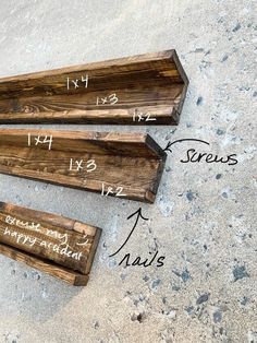 three pieces of wood that have measurements for each piece of wood on the ground, and labeled with numbers