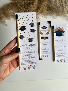 two graduation cards with pencils in front of them