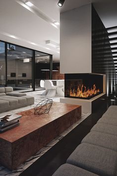 a living room with a couch and a fire place in it's centerpiece