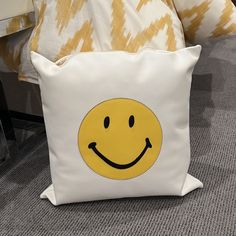 a pillow with a smiley face on it