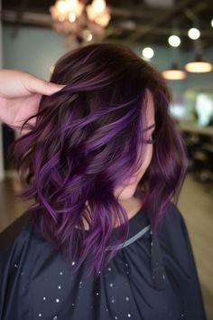 Rich, vibrant plum curls that are perfect for the modern sophisticate. Tap the link for more purple hair inspiration! Dimensional Purple Hair, Balayage Purple, Purple Hues Hair, Purple Fashion Color Hair, Color Balayage Hair, Plum Hair With Highlights, Eggplant Purple Hair, Purple Hair Bob, Dark Brown And Purple Hair