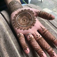 henna tattoo on the palm of someone's hand