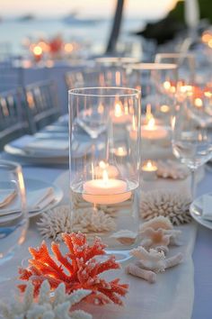 Transform your beach wedding reception with simple, rustic, and elegant decor ideas. Incorporate boho and Indian themes, with seashells and surf elements in the table decorations to create a stunning and unique celebration.Clear chat Simple Beach Decor Wedding, Beach Decor For Wedding, Beach Style Wedding Decorations, Wedding Water Theme, Seashell Wedding Table Decor, Sand Centerpieces Wedding, Beachy Wedding Table Decor, Wedding Beach Decorations, Boat Engagement Party