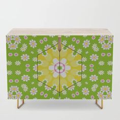 a green and yellow cabinet with flowers on it