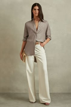 Find REISS Sian Relaxed Fit Lyocell Linen Button Through Shirt on Editorialist. The Sian shirt is made from a smooth lyocell-linen blend with a naturally marled appearance. Dropped shoulder seams relax this smart silhouette. Lyocell-linen blend. Dropped shoulder seams. Button-front closure. Split hem. Relaxed fit. The model is wearing a size 8. Measurements of model: Height 5 10 / 177.8cm Going Out Trousers, Of Model, Tie Shoes, Split Hem, Workwear Dress, Modest Outfits, Linen Shirt, Linen Blend, Work Wear