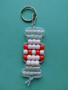 *Peppermint Candy Keyrings *Great for stocking stuffers! *Perfect for decorating gifts or gift bags! *Great for party favors! *Keyrings can be clipped onto backpacks, accessory bags, keychains, and bags. *Available in a set of 4: Each set includes 2 red and 2 green Peppermint Candy Keyrings. *Each set of 4 is $6.00. *Materials used: colored beads, transparent beads, beading cord, keyrings, and lanyard clips. Thanks for visiting our shop! Kandi Charms, Bead Buddies, Keychain Patterns, Seed Bead Art, Pony Bead Bracelets