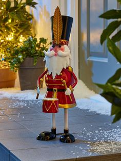 a nutcracker is standing in front of a house