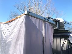 an awning attached to the roof of a vehicle