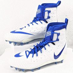 a pair of white and blue nike shoes on top of a white surface with the word,