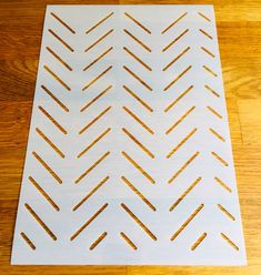 the pattern is made out of white paper and has gold foil on top of it