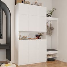 a living room with white cabinets and wood floors