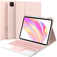 an open laptop computer sitting on top of a white table next to a pink keyboard