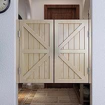 an open door leading to a hallway with a clock on the wall and tiled floor