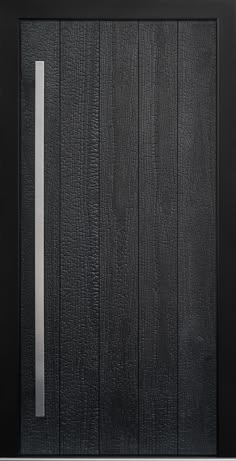 a black door with a metal handle on the side and wood grained paneling