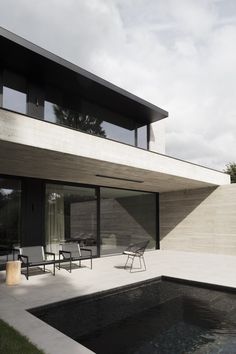 a modern house with a pool in the yard