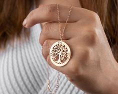 Our Tree of Life Necklace is more than simply a lovely piece of jewelry; it also serves as a potent representation of family, connection to nature, and personal development. The pendant's elaborate design features a tree with upward-facing branches and earthbound roots, signifying the harmony between heaven and earth and the interdependence of all living things. Our Tree of Life Necklace is made to last because it was expertly made using only the best materials. The chain is sturdy and adjustable to comfortably fit any neck size, and the pendant is constructed of top-notch metal. You can select the necklace's finish from three options, including rose gold, gold, and silver, depending on what best suits your particular style. * Material: Copper, Sterling Silver * Color: Silver, Gold, Rose G Personalized Nature-inspired Necklaces As A Gift For Her, Nature-inspired Rose Gold Necklace, Tree Of Life Necklace For Gift, Nature-inspired Rose Gold Jewelry Gift, Gold Rose Necklace, Necklace Family, Grandma Necklace, Mother Necklace, Anniversary Necklace