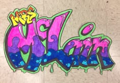 the word graffiti is painted in purple and green