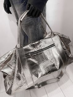 Indulge in the exquisite craftsmanship of our handmade SNAKESKIN Weekender/Duffle bag.  With a focus on premium quality, this travel companion boasts a removable shoulder strap for added convenience, making it equally appealing to both men and women. Dimensions: - Width: 55 cm/21.6 in - Height: 36 cm/14.1 in - Depth: 24 cm/9.4 in Inside, discover a thoughtfully designed interior with a handy zipper pocket. Our commitment to perfection is evident in the rigorous testing each new model undergoes a Luxury Large Capacity Pouch Bag, Luxury Travel Shoulder Bag With Dust Bag, Luxury Large Capacity Pouch Shoulder Bag, Luxury Shoulder Travel Bag With Dust Bag, Designer Rectangular Bags For Trips, Everyday Luxury Large Capacity Rectangular Shoulder Bag, Luxury Large Capacity Duffle Bag With Top Handle, Luxury Large Capacity Top Handle Duffle Bag, Luxury Large Capacity Satchel Duffle Bag