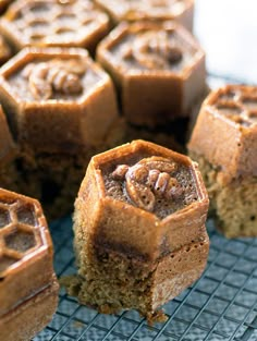 several pieces of cake sitting on a cooling rack