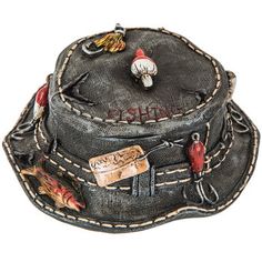 Stow away your favorite jewelry and trinkets in style with Fishing Hat Jewelry Box. Shaped like a rustic fishing hat with realistic stitching, tackle and fish, this sporty box is the perfect item for the special husband, father and sporty gent in your life. Reel in a great gift!        Dimensions:          Length: 5 1/2"       Width: 5 1/4"       Height: 2 7/16" Fishing Hat Drawing, Fishing Gnomes, Fishing Crafts, Fishing Bucket Hat, Fishing Tournament, Fishing Shack, Fish Designs, Fishing Wedding, Hat Jewelry