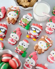 many decorated cookies are sitting on a table