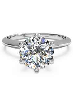 a white gold engagement ring with a round cut diamond