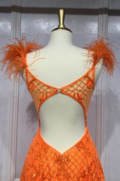 Ladivine KV1076 neon orange ball gown with feathers and an open back