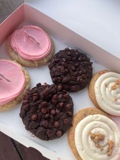 a box filled with lots of different flavored cookies