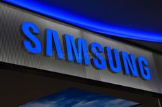 the samsung sign is lit up at night