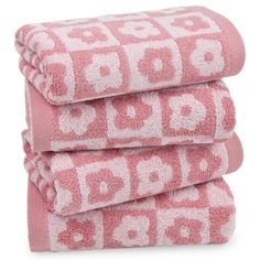 three towels stacked on top of each other in pink and white colors with numbers printed on them