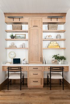 two desks with open shelves and chairs in front of them on wooden flooring