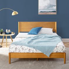 a bedroom with blue walls and white carpet