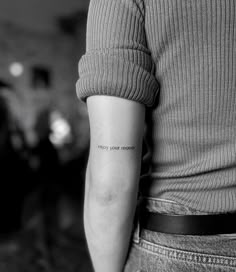 a person with a small tattoo on their arm