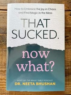 a book that is sitting on top of a wooden table with the title, that sucked now what?