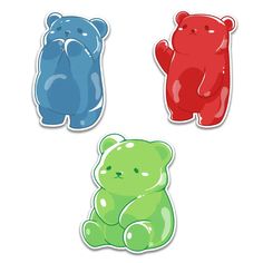 three different colored teddy bears sitting next to each other