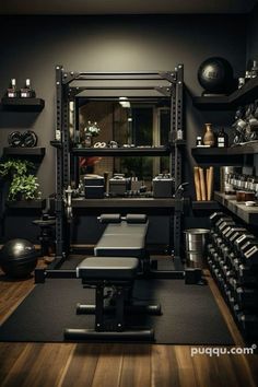 a home gym with black walls and wooden floors