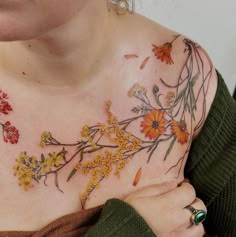 a woman with flowers painted on her chest