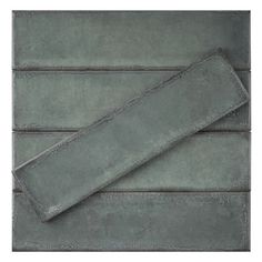 a gray towel laying on top of a wooden floor