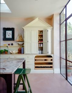 the kitchen is clean and ready to be used as a wine bar or even for entertaining