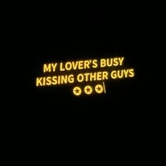 a neon sign that says, my lover's busy kissing other guys