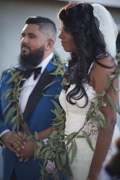 the bride and groom are looking at each other