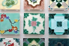 several different types of glass tiles on display