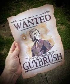 someone is holding up a wanted guybrush sign