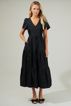 The Alexis Poplin Tiered Midi Dress is ready to make you the sweetest sight to see in any room you walk into! A tiered style shapes this lovely dress that features a smocked design on the sides and short sleeves with a v neckline. Dress is up with heels or causal with sneakers. - V-neck- Tiered- Puff sleeves- Smocked- Comes in 3 colorsSize + Fit - Model is 5'8" and wearing size XS- Measurements taken from size S - Chest: 16 1/2"- Length: 53 1/2" Fabric Self:100% Cotton Lining:97% Polyester 3% Sp V Neckline Dress, Neckline Dress, Tiered Midi Dress, Versatile Dresses, Sweater Sale, V Neckline, Lovely Dresses, Tiered Dress, Black Midi Dress