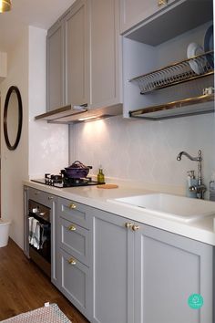 a kitchen with an oven, sink and dishwasher